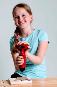 Girl drilling with the ToolKid drill